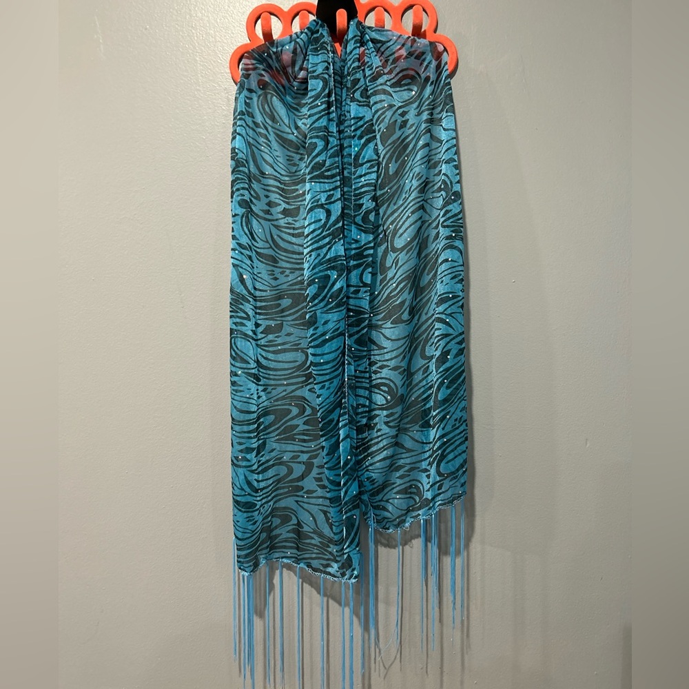 Sheer blue zebra print scarf very lightweight. Fringe trimmed. 100% Polyester